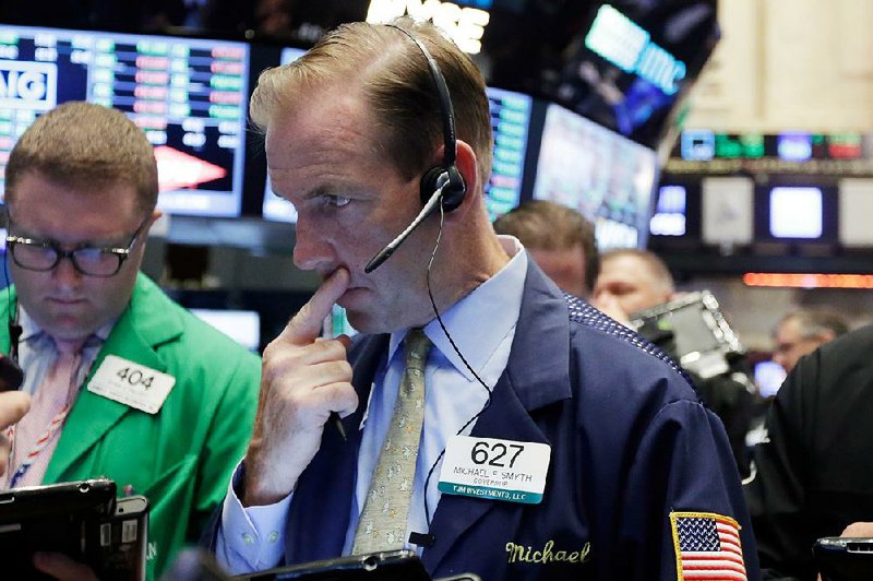 Trader Michael Smyth works Wednesday on the floor of the New York Stock Exchange where U.S. stocks advanced. The Standard & Poor’s 500 index posted its strongest two-day climb in four months as tension eased over the impact of a U.K. exit from the European Union. 
