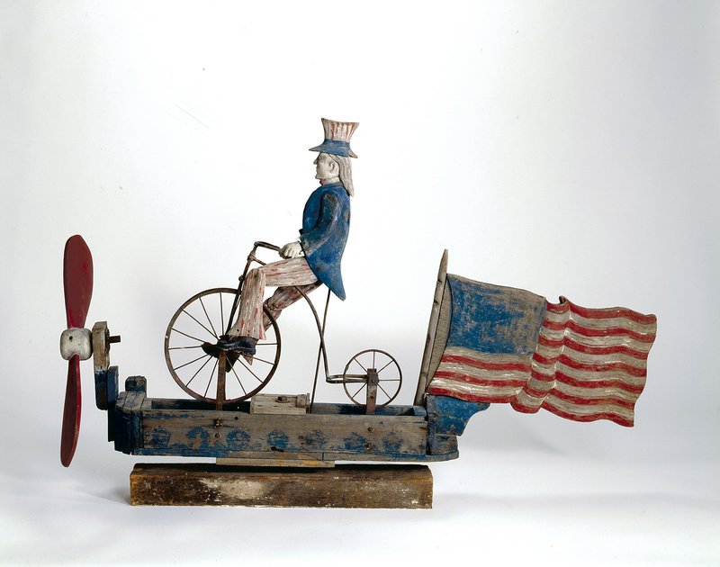 Uncle Sam Riding a Bicycle Whirligig, ca. 1880–1920, paint on wood with metal, Collection American Folk Art Museum, New York; gift of Dorothea and Leo Rabkin. 