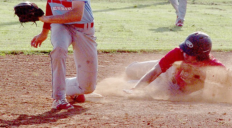 McDonald County&#8217;s Victor Payne is safe at second base during McDonald County&#8217;s 13-10 loss in 10 innings to Webb City on June 21 at MCHS.