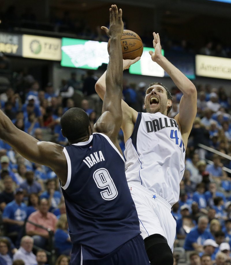  In this April 23, 2016, file photo, Dallas Mavericks forward Dirk Nowitzki (41) shoots against Oklahoma City Thunder forward Serge Ibaka (9) during the second half in Game 4 of a first-round NBA basketball playoff series, in Dallas. 