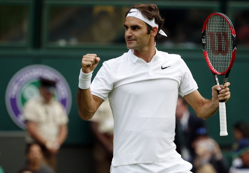 Roger Federer of Switzerland celebrates after beating Guido Pella of Argentina in their men's singles match on day one of the Wimbledon Tennis Championships in London, Monday, June 27, 2016.