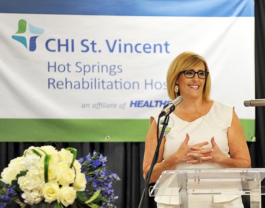 The Sentinel-Record/Mara Kuhn GRAND OPENING: Janette Daniels, CEO of CHI St. Vincent Hot Springs Rehabilitation Hospital, an affiliate of HealthSouth, speaks to a crowd gathered Wednesday afternoon for the grand opening of the new renovated facility at 1636 Higdon Ferry Road. The inpatient rehabilitation hospital offers 40 all-private rooms, an on-site therapy gym and cutting edge rehab technologies to patients.