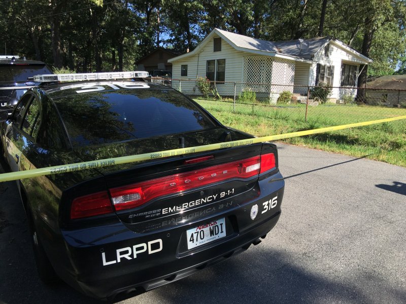 Police work the scene of a triple-shooting in a home on Zion Street in Little Rock.