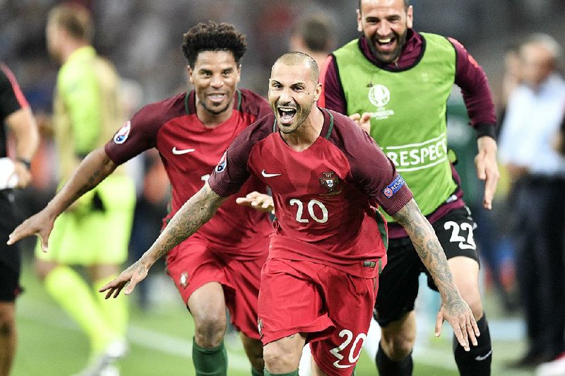 Forward Ricardo Quaresma (center) celebrates with his teammates after his penalty kick pushed Portugal past Poland on Thursday and into the semifinals of the European Championships.