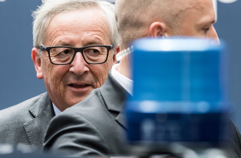 European Commission President Jean-Claude Juncker, left, leaves an EU summit in Brussels on Wednesday, June 29, 2016. European Union leaders are meeting without Britain for the first time since the British referendum to rethink their bloc and keep it from disintegrating after Britains unprecedented vote to leave. 