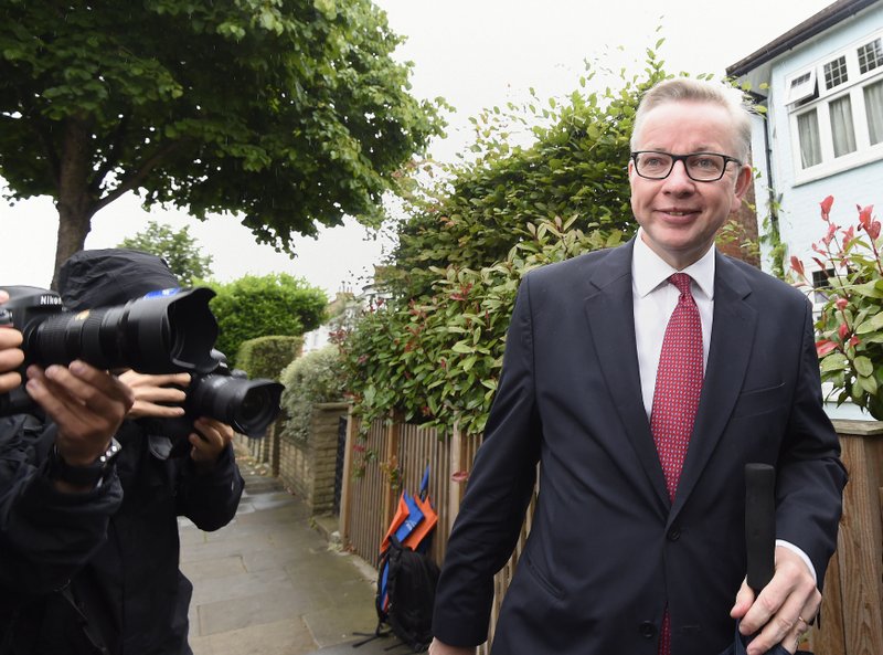 Michael Gove leaves his home in London, as he prepared to set out his case for becoming prime minister, Friday July 1, 2016. The candidates to succeed David Cameron as Conservative Party leader are starting their campaign to become Britain's prime minister which will shape Britain's future relationship with the European Union. (Lauren Hurley / PA via AP)
