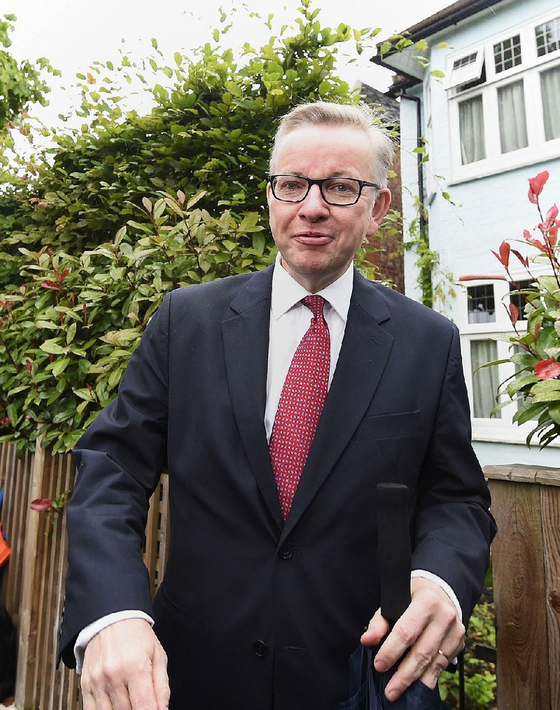 Michael Gove leaves his home Friday in London. He characterized himself as a reluctant candidate for prime minister, saying he possesses no charisma. 