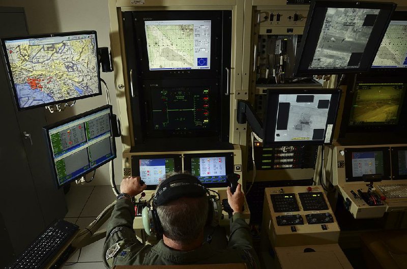 A pilot guides a drone from Hancock Field Air National Guard Base in New York in 2012. U.S. drone strikes against terrorism suspects have killed between 64 and 116 civilians unintentionally, officials said Friday, but independent groups say the figure is much higher.