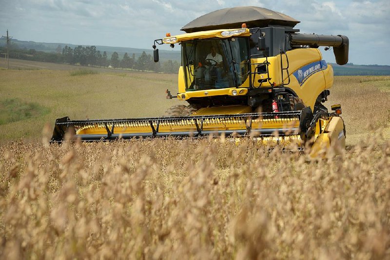 A combine harvests soybeans at the Sitio Azulao farm, near Itapetininga, Brazil, earlier this year. 