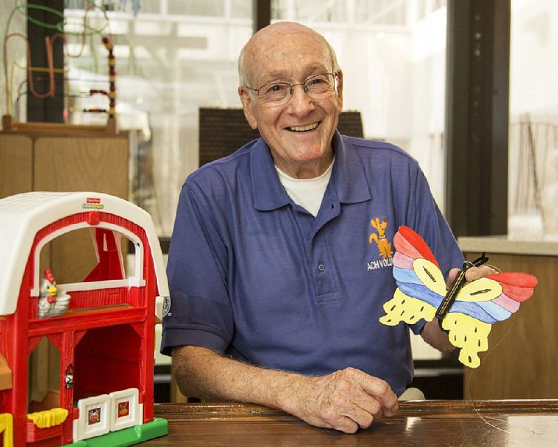 Fant Jarrett holds a make-it-yourself butterfl y, one of the craft projects he brings to the playroom where he volunteers at Arkansas Children’s Hospital in Little Rock. “This is the fun job,” he says. “We get to get children out of their rooms, into fun activities so they can forget they’re ill.”