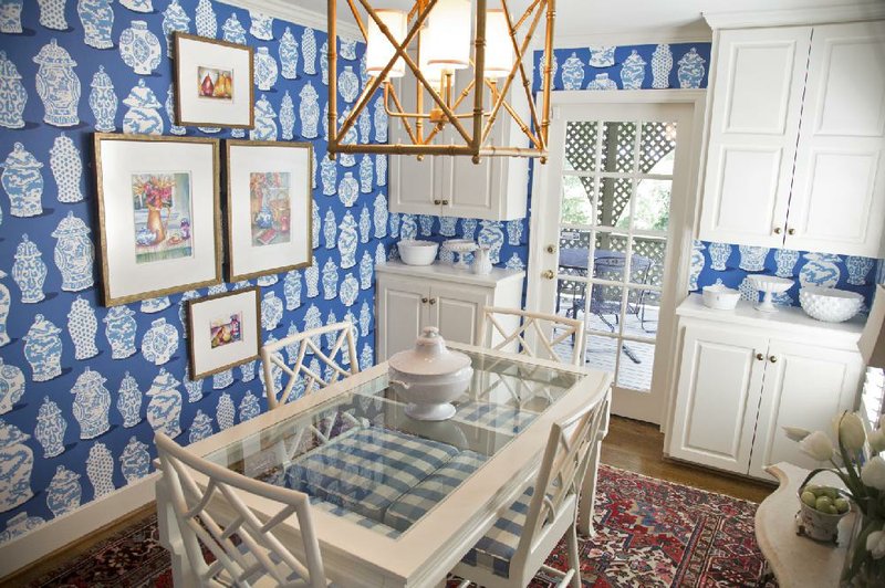 Bright blue paper with a strong pattern decorates the kitchen and breakfast room walls in the home of Becky and George Wells of Little Rock.