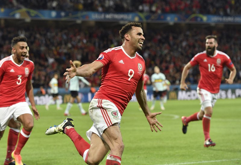 Wales' Hal Robson Kanu, center, celebrates after scoring his sides second goal during the Euro 2016 quarterfinal soccer match between Wales and Belgium, at the Pierre Mauroy stadium in Villeneuve dAscq, near Lille, France, Friday, July 1, 2016.