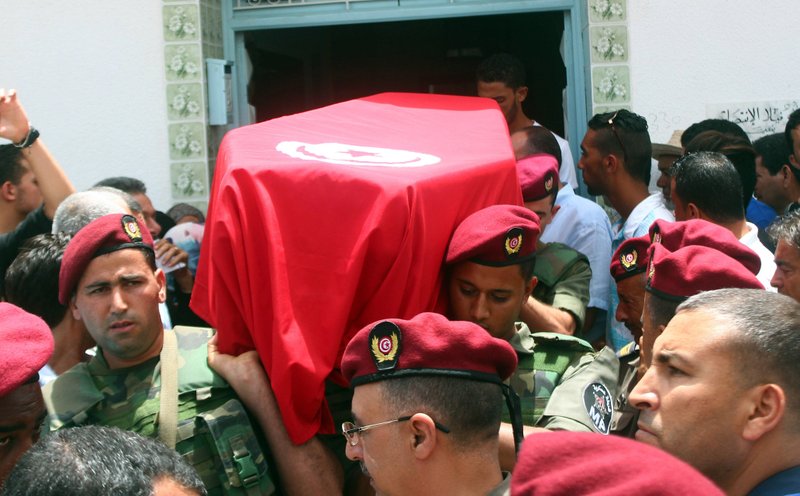 Family, friends and officers carry the Tunisian flag-draped coffin of the head of the pediatric service at the Tunis military hospital, Col. Fathi Bayoudh, one of the victims killed Tuesday at the blasts in Istanbul's Ataturk airport, during his funeral in Ksour Essaf, southern Tunisia, Friday, July 1, 2016. 