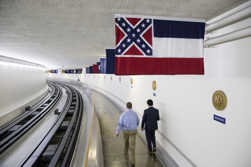 The Mississippi state flag is displayed with the banners of other American states, territories and commonwealths, above a walkway in the tunnel from the Capitol Building to the Dirksen Senate Office Building in Washington, Friday, July 1, 2016.