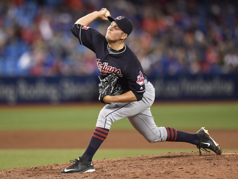 Cleveland Indians pitcher Trevor Bauer pitches against the Toronto Blue Jays during the 15th inning of a baseball game in Toronto, Friday, July 1, 2016. 