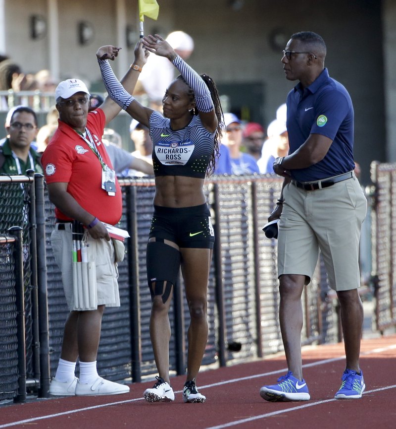 Sanya Richards-Ross waves to the crowd after after pulling up 250 meters into her lap around the track during qualifying for women's 400-meter run at the U.S. Olympic Track and Field Trials, Friday, July 1, 2016, in Eugene Ore. 