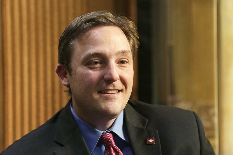 In this photo taken Dec. 16, 2014, Rep. Jeremy Gillam, R-Judsonia, is interviewed at the Arkansas state Capitol in Little Rock, Ark. 