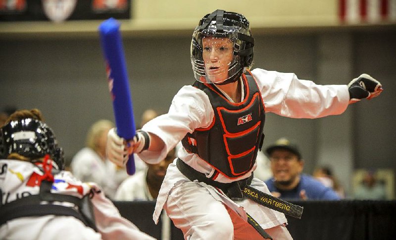 Jessica Wartberg, of Boco Raton, Fla. right, competes with Elisa Colon, of Jacksonville, Fla. in combat sparing at the American Taekwondo Association World Expo/ World Championships 2016 in this file photo.