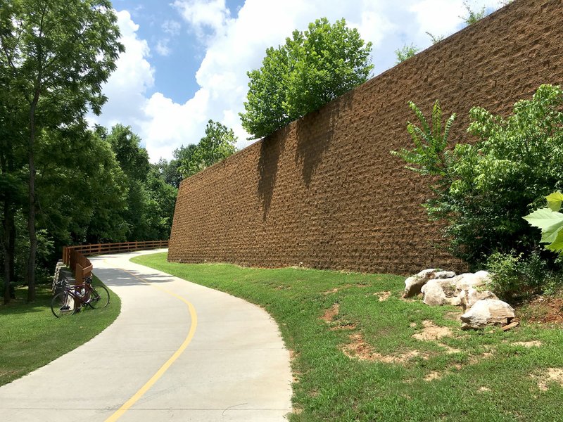 The Great Wall of Lowell is a formidable sight along the Razorback Greenway. The retaining wall is south of Arkansas 264.