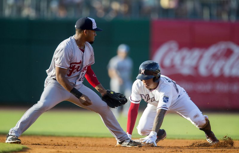 Raul Mondesi safely steals second base as the throw gets past Frisco second baseman Andy Ibanez on Monday, July 4, 2016, at Arvest Ballpark in Springdale.