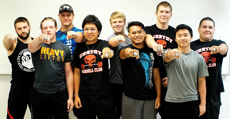 Photo by Randy Moll Gentry High School students Kaven Flesner, Keeten Jones, Chance Cooper, Tylor Lor, Trey Welch, Peter Thao, Mason Clark, Tyous Lor and Tomas Gomez show the rings earned when they became champions in the national power-lifting competition earlier this year. Champions not pictured include Lawrence Caro, Tanner Christie, Kong Lor and Khang Yang.