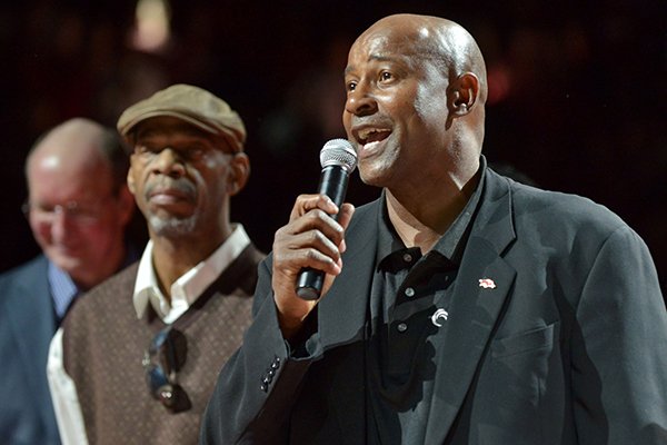 Arkansas basketball legend Sidney Moncrief speaks to the crowd during halftime of a game against Mississippi State on Feb. 7, 2015, at Bud Walton Arena in Fayetteville. Moncrief was honored with a replica of his jersey being hung in the rafters. 