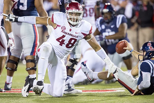 Arkansas defensive lineman Deatrich Wise gets up after sacking Ole Miss quarterback Chad Kelly on Saturday, Nov. 7, 2015, late in the fourth quarter at Vaught-Hemingway Stadium in Oxford, Miss.