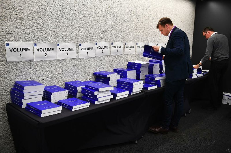 Copies of the 12-volume, 2.6 million-word Iraq Inquiry Report sit on display Wednesday in London. 