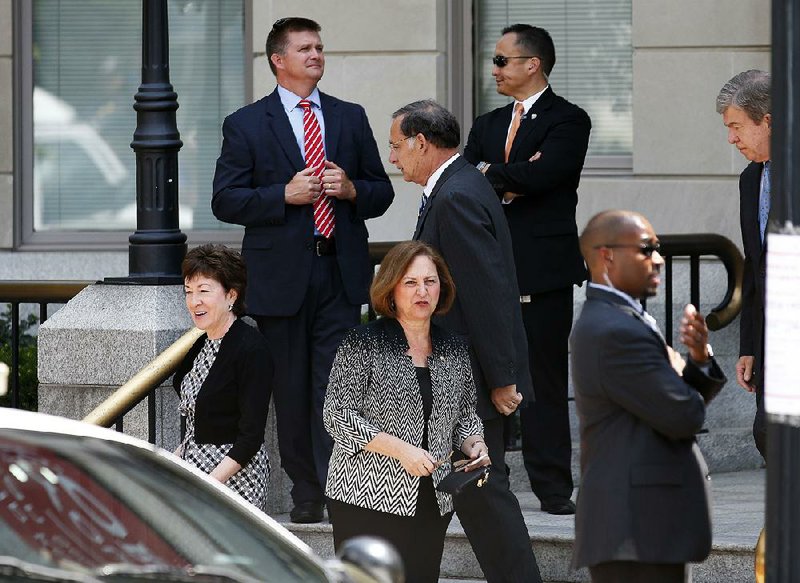 Republican Sens. Susan Collins of Maine (left); John Boozman of Arkansas (center); and Deb Fischer of Nebraska; and others leave after Thursday’s meeting with Donald Trump.