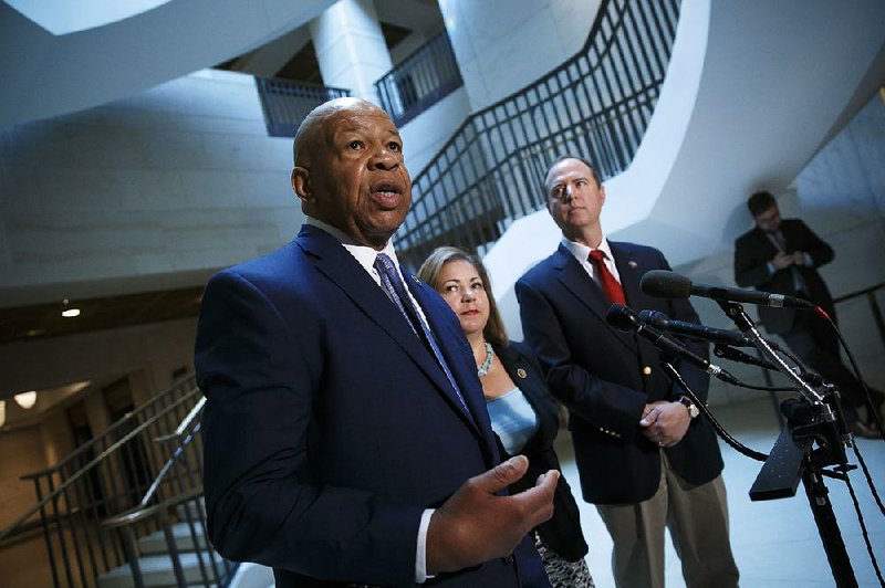 Rep. Elijah Cummings, D-Md. (left), joined by fellow House Benghazi Committee members Linda Sanchez, D-Calif., and Adam Schiff, D-Calif., said Friday after the vote to approve the committee’s report that House Republicans are “addicted” to Benghazi.