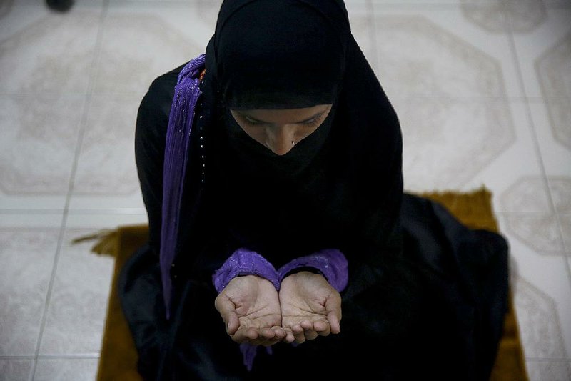 Shagufta Sayyd prays at the office of the Indian Muslim Women’s Movement in Mumbai, India. She has joined other Indian Muslim women campaigning against an Islamic legal practice that allows men to divorce their wives by simply saying “divorce” three times. 