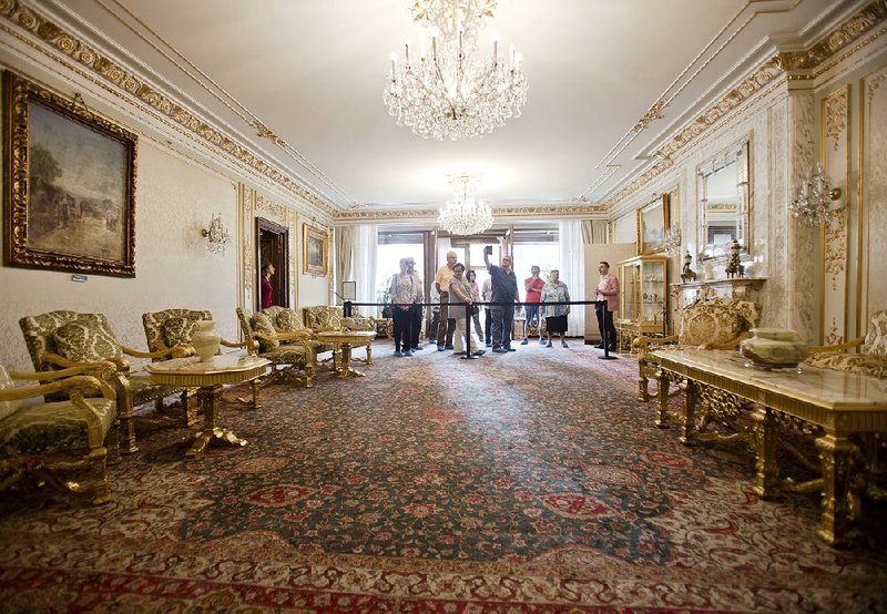Tourists explore one of the rooms in the Palace of Spring in Bucharest, Romania. The former home of dictator Nicolae Ceausescu was transformed into a museum earlier this year. 