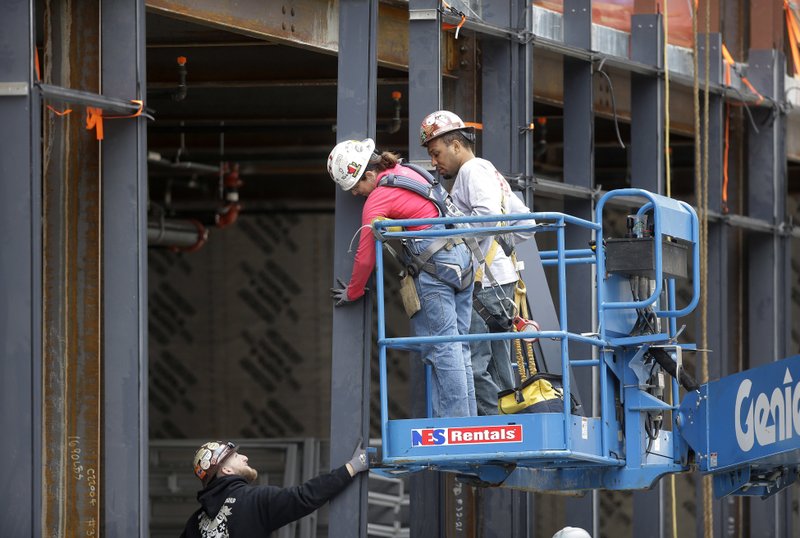 Construction workers were on the job in May, putting up a building in Boston. Despite gains in the job market last month, Bill Spriggs, chief economist at the AFL-CIO, said hiring was lackluster in construction and durable manufacturing.