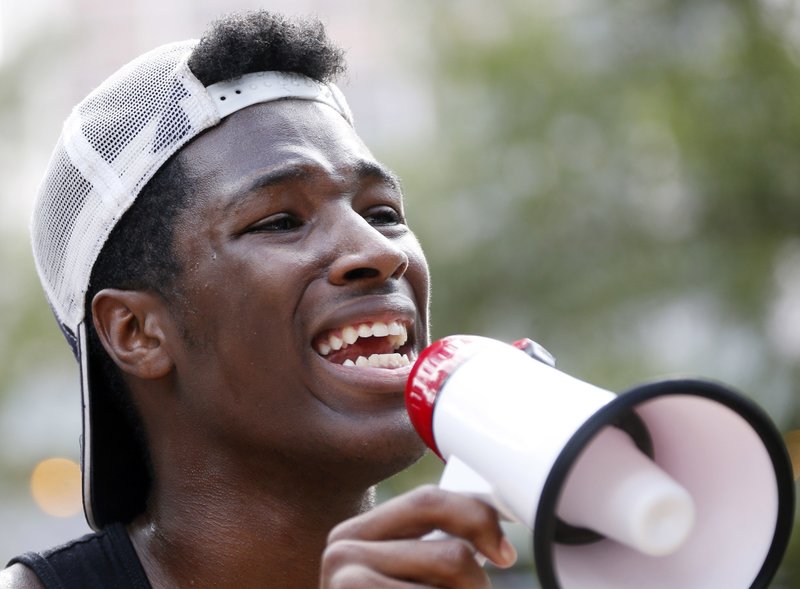 J’Shon Perkins, 17, of Jackson, Miss., thanks the almost 200 young marchers for participating Friday afternoon in a peaceful protest march in downtown Jackson, to call attention to the apparent escalation of violence by authorities on black men and also honoring the five police officers killed Thursday evening in Dallas. The marchers chanted various slogans and the names of the men killed in police shootings in Minnesota and Louisiana. 