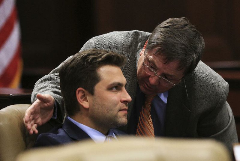 Senate President Pro Tempore Jonathan Dismang, R-Searcy, left, is shown with Sen. Larry Teague, D-Nashville, during a meeting of the Senate Committee on Insurance and Commerce. 