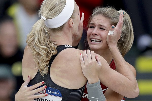 Alexis Weeks, right, gets a hug from Sandi Morris after the women's pole vault final at the U.S. Olympic Track and Field Trials, Sunday, July 10, 2016, in Eugene Ore. (AP Photo/Charlie Riedel)