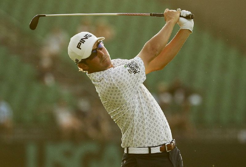 Former Arkansas Razorbacks All-American Andrew Landry wears a patch advertising Moonshine Sweet Tea as
he plays in the third round of the U.S. Open last month in Oakmont, Pa.