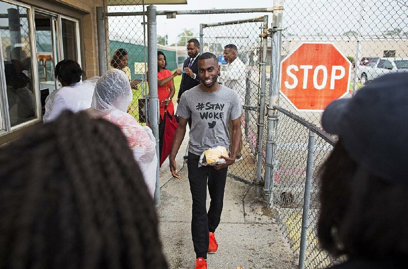 FILE PHOTO: Black Lives Matter activist DeRay McKesson walks out of the Baton Rouge jail in July 2016.