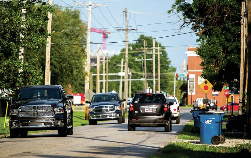 Morning traffic moves Friday along Southeast Eighth Street in Bentonville.
