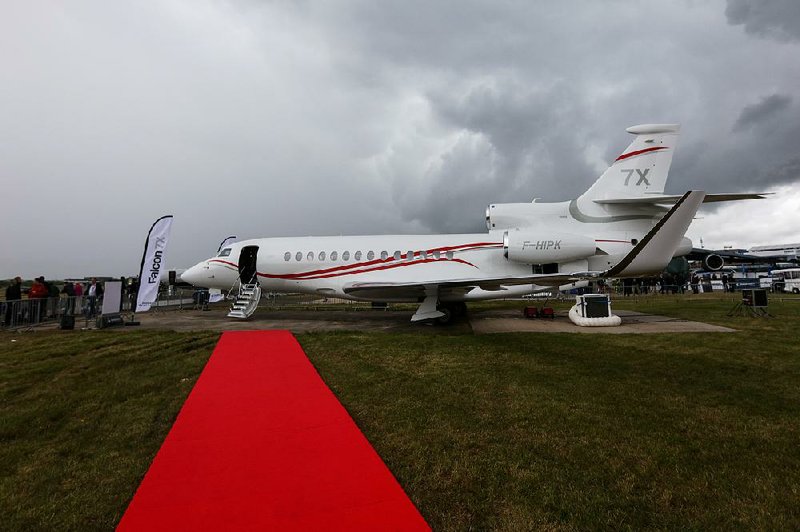 A Falcon 7X business jet, manufactured by Dassault Aviation SA, is displayed Tuesday on the second day of the Farnborough International Air Show in Farnborough, U.K. Interior detail work and painting of Dassault’s business jets are completed at a facility at Bill and Hillary Clinton National Airport/Adams Field.  