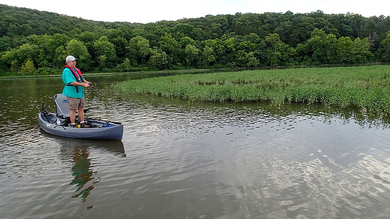 NWA Democrat-Gazette/FLIP PUTTHOFF Lake Sequoyah, on the southeastern edge of Fayetteville, has lots of vegetation that makes fine habitat for black bass and other game fish. Mike McBride fishes June 24, 2016 near an island of grass for black bass. It&#8217;s easy to cover the whole lake in a canoe or kayak.