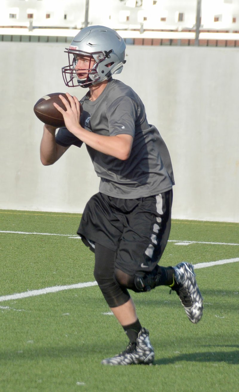 Graham Thomas/Herald-Leader Sophomore L.T. Ellis completed 7 of 15 passes for 93 yards and two touchdowns in 7-on-7 action Monday night at Panther Stadium.