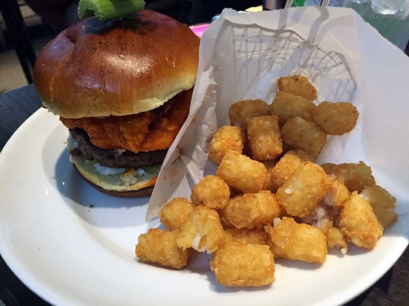 Can’t decide between a burger or buffalo wings? Dave & Buster’s Buffalo Wing Burger, served with tots, has it all. 