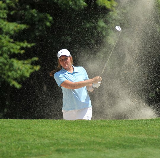 The Sentinel-Record/Mara Kuhn GARNERING RESPECT: Kirsten Garner, of Hot Springs, blasts out of a bunker onto a front-nine green during her first-round match of the Arkansas State Golf Association Women's Match Play Wednesday at DeSoto Golf Course in Hot Springs Village. Garner defeated soon-to-be Arkansas Golf Hall of Famer Julie Oxendine, of Russellville, 2 and 1.