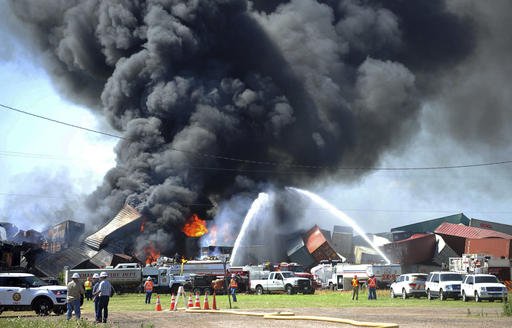 In this June 28, 2016, file photo, emergency personnel battle flames following a head-on collision of two freight trains in Panhandle, Texas.