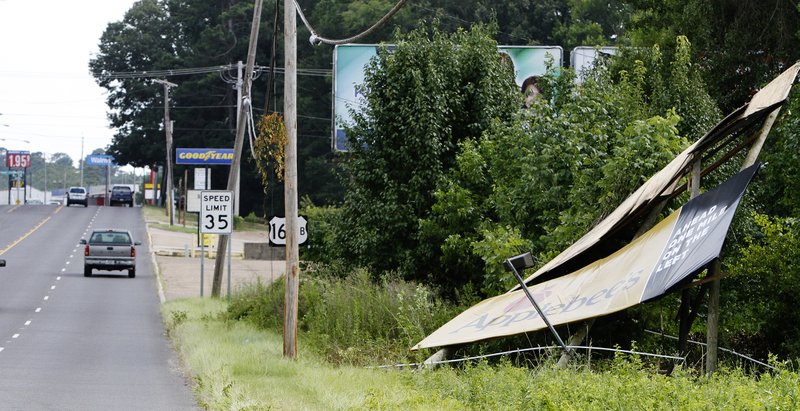 Blown away: Strong winds from a storm system on Thursday damaged a billboard along North West Avenue.