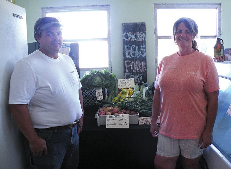 Jay and Valorie Lee sell locally grown produce and meats on JV Farms in Bismarck. Shown here in the milk barn on their farm, the Lees are the 2016 Hot Spring County Farm Family of the Year.
