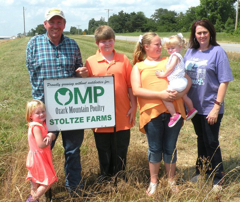 The Brian Stoltze family of the Ben community is the 2016 Stone County Farm Family of the Year. Members of the family include, from left, Kameryn Stoltze; Brian Stoltze; Drake Foster of Rose Bud, one of Brandy Stoltze’s nephews who helps on the farm; Kayden King, holding her youngest sister, Kyleigh Stoltze; and Brandy Stoltze. The family raises cattle and chickens.