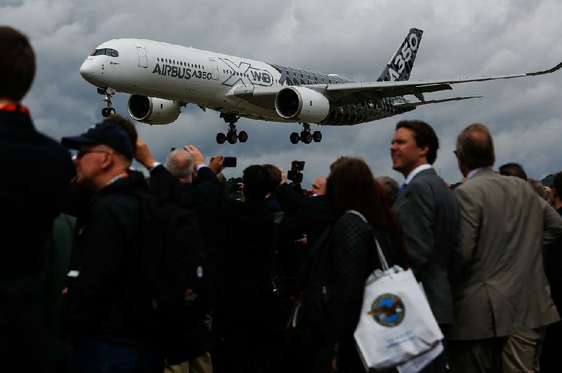 An Airbus SE A350 jet lands after a flight earlier this week during the Farnborough Airshow in England. 