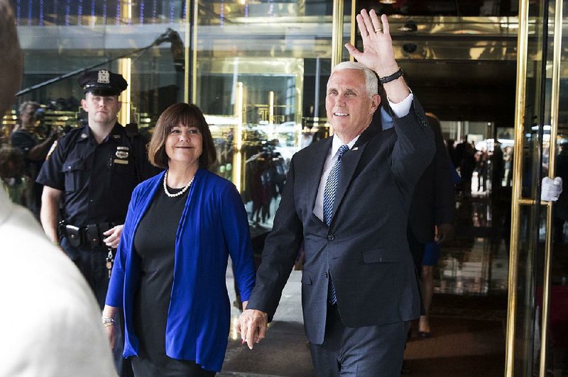Indiana Gov. Mike Pence and his wife, Karen, leave a meeting Friday with Donald Trump at Trump Tower in New York after Trump tweeted news of Pence’s selection as his running mate.